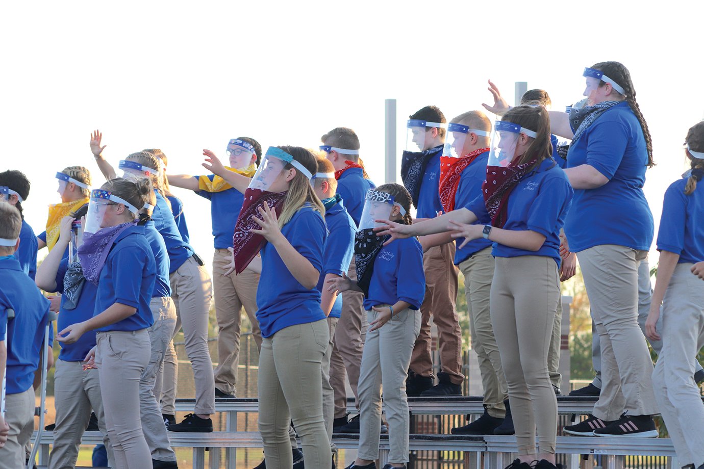 Seventh-grade students from North Montgomery Middle School perform their fall choir concert Wednesday evening in the high school parking lot.